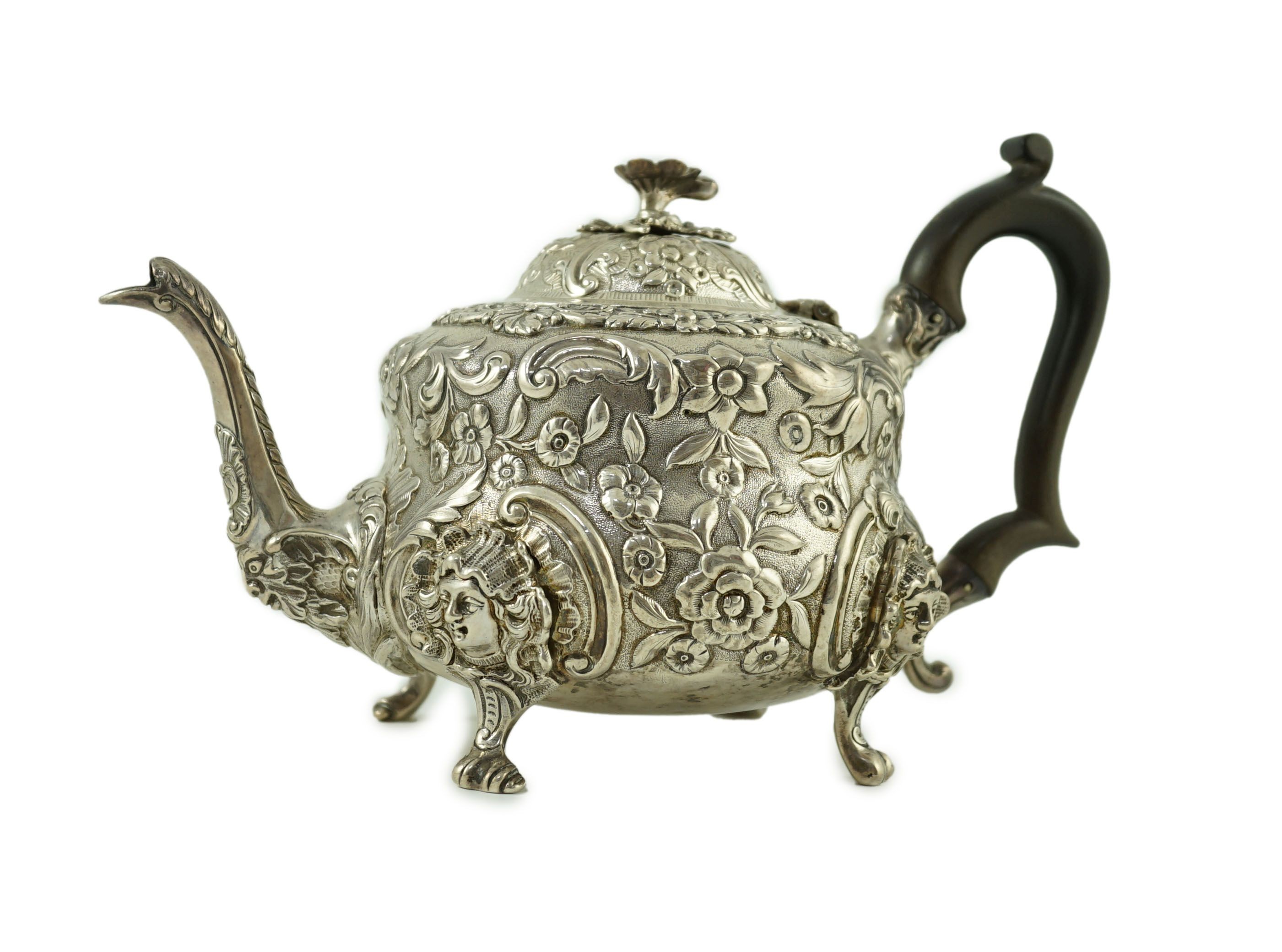 An early Victorian embossed silver teapot, by William Moulson